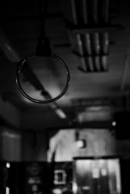 A suspension ring hangs from the rafters of the clubhouse